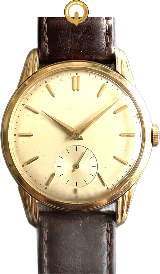 The same watch, turned into a charm with a gold ring at the top.